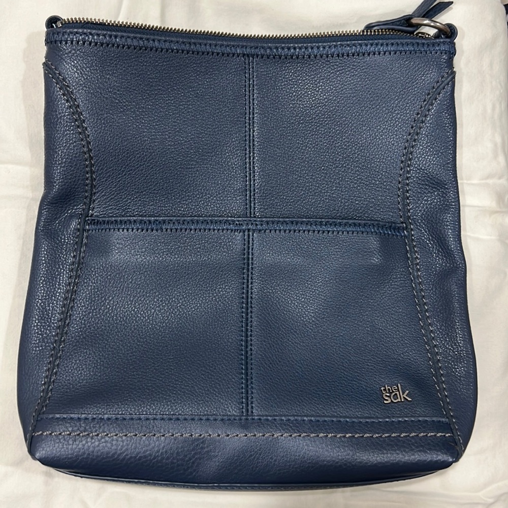 The sak crossbody iris blue leather purse.
